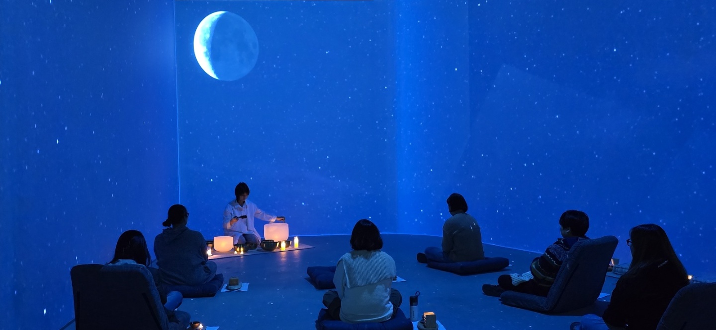Composite hero image presenting Soojin Pray and participants within the immersive forest environment of Digital Forest Meditation Odyssey